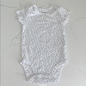 White polkadot baby onesie